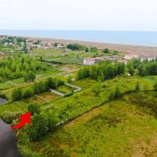 زمین ساحلی210متری پشت شهرک ویلایی