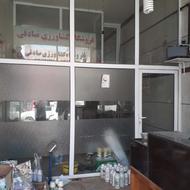 درب پی وی سی وسط مغازه