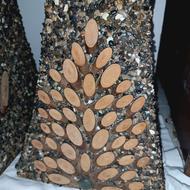 گلدانهای زیبا با کمک سنگریزه های ساحل و چوب درست شده است