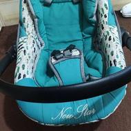 کریر سبز فیروزه ای همراه با سایه بان