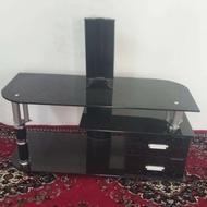 میز تلویزیون شیشه ای به همراه سطل اشغال و دستمال کاغذی مشکی