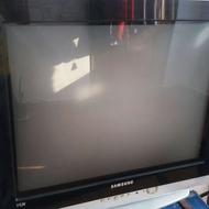 یک تلویزیون رنگی ومیز تلویزیون