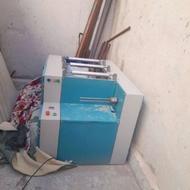 دستگاه رول کن کیسه زباله وسفره یکبارمصرف