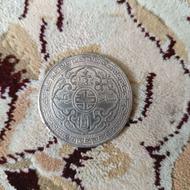 سکه 1 دلاری لیبریتی و سکه بریتانیایی