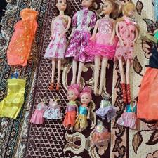 عروسک باربی همه یک جا همراه ست لباس